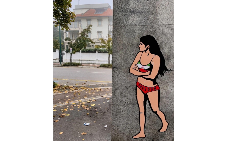 Эсэргүүцлээ нүцгэлж илэрхийлсэн иран оюутныг Италийн зураач байшингийн ханан дээр зуржээ